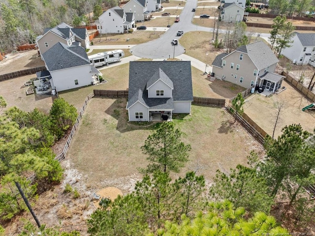 birds eye view of property with a residential view