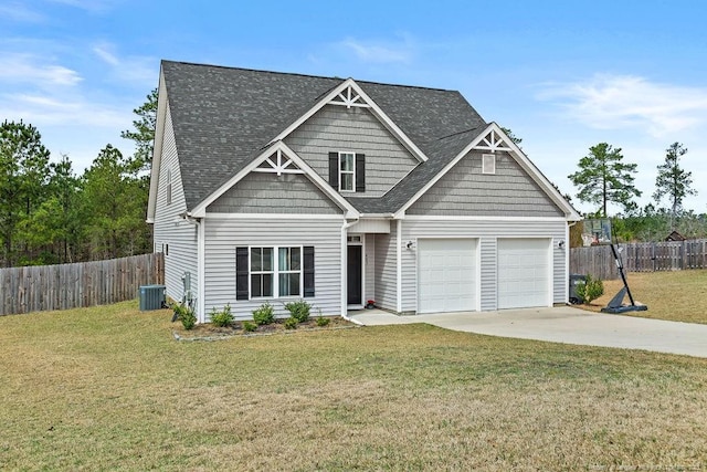 craftsman-style home featuring fence, roof with shingles, central AC, a front lawn, and concrete driveway