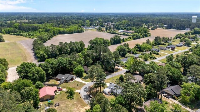 drone / aerial view featuring a view of trees