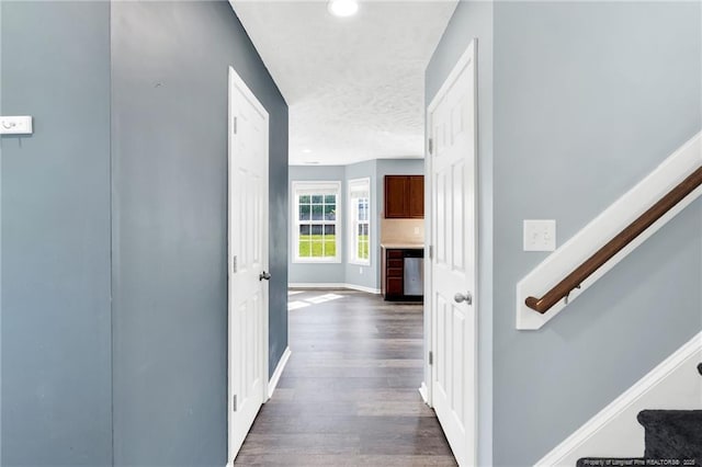 hallway with baseboards, stairway, recessed lighting, a textured ceiling, and dark wood finished floors