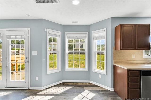 doorway to outside with recessed lighting, baseboards, dark wood finished floors, and visible vents