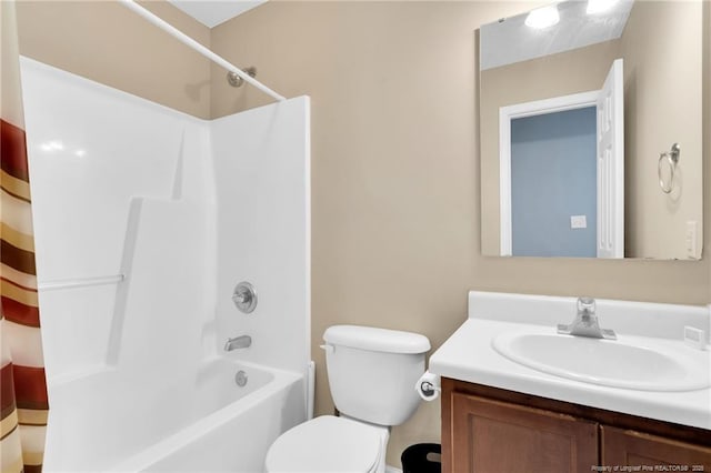 bathroom featuring vanity, shower / bath combo, and toilet