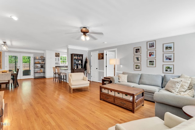 76 Bergeson Ct, Fuquay Varina, NC 27526 - living room featuring ceiling fan, crown molding, and light wood-type flooring