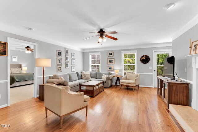 76 Bergeson Ct, Fuquay Varina, NC 27526 - living room with a ceiling fan, light wood-style flooring, crown molding, and baseboards