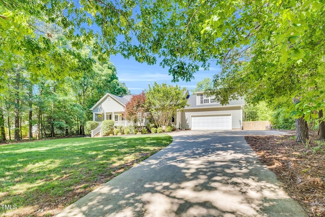 76 Bergeson Ct, Fuquay Varina, NC 27526 - view of property hidden behind natural elements featuring concrete driveway and a garage