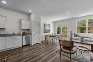 living area featuring recessed lighting and dark wood finished floors