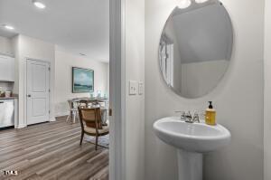 bathroom featuring recessed lighting and wood finished floors