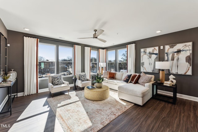 living room featuring baseboards, a ceiling fan, recessed lighting, and wood finished floors
