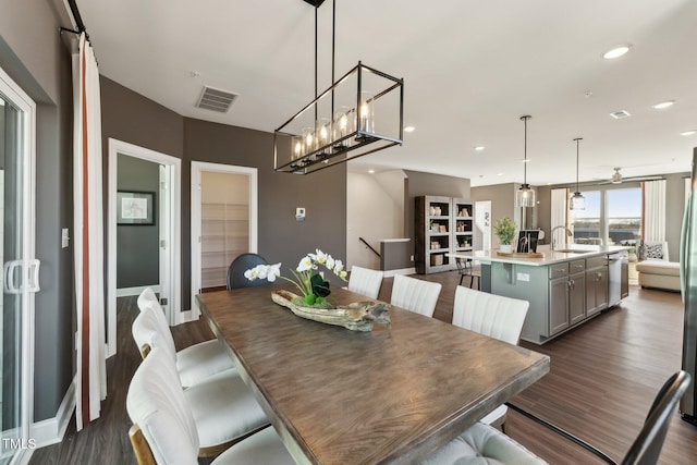 dining room with recessed lighting, visible vents, and dark wood finished floors