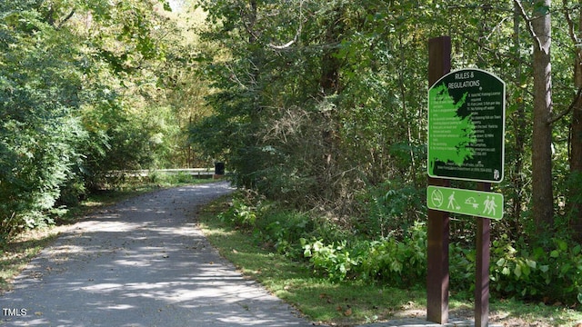 view of home's community featuring aphalt driveway