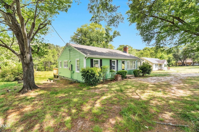 2677 NC-39, Henderson, NC 27537 - single story home with roof with shingles and a chimney