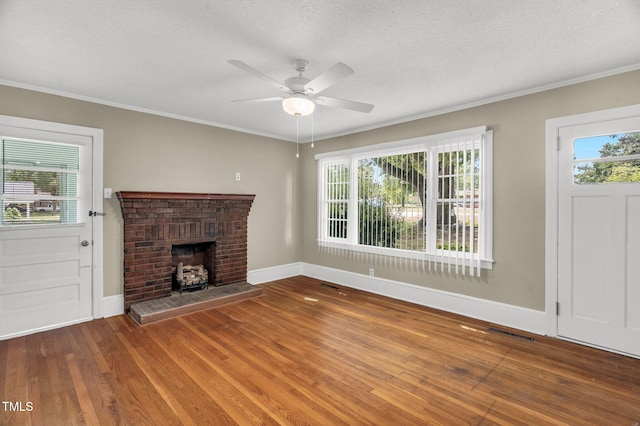 2677 NC-39, Henderson, NC 27537 - unfurnished living room featuring baseboards, crown molding, ceiling fan, and a wealth of natural light