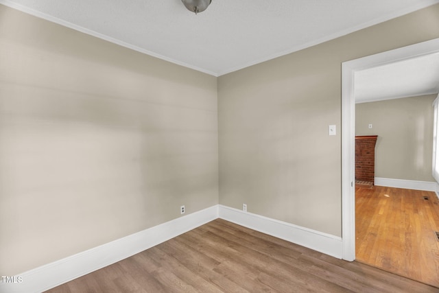 2677 NC-39, Henderson, NC 27537 - unfurnished room with baseboards, ornamental molding, and wood finished floors