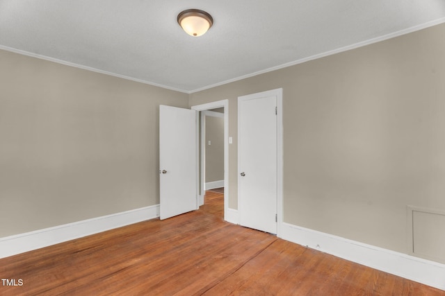 2677 NC-39, Henderson, NC 27537 - spare room with crown molding, baseboards, and wood finished floors