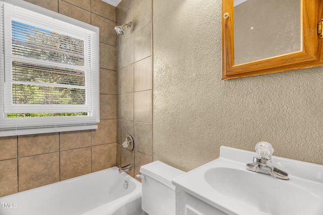 2677 NC-39, Henderson, NC 27537 - bathroom with washtub / shower combination, a textured wall, vanity, and toilet