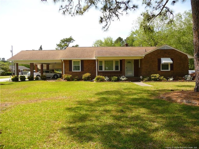 185 Meadow Rd, Lumberton, NC 28358 - ranch-style house with brick siding, a chimney, a front yard, and a carport