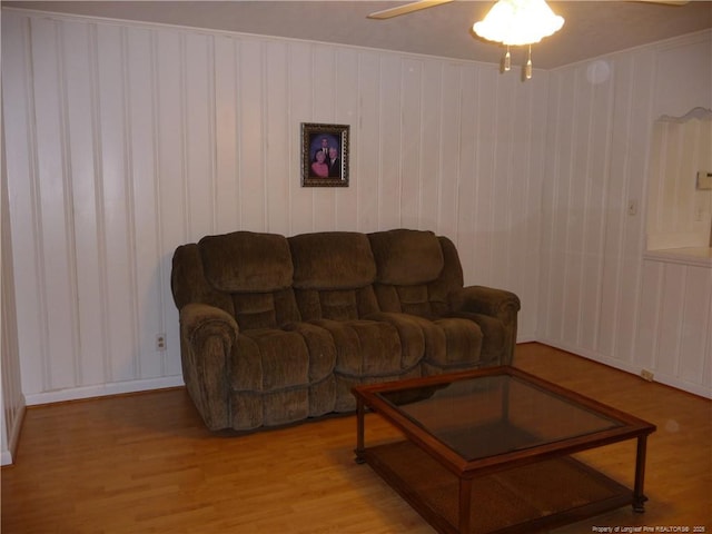 185 Meadow Rd, Lumberton, NC 28358 - living room with baseboards, ceiling fan, wood finished floors, and a decorative wall