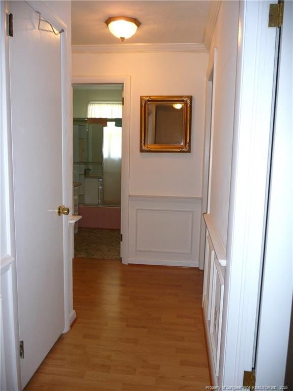 185 Meadow Rd, Lumberton, NC 28358 - hall with ornamental molding, a decorative wall, and light wood-type flooring