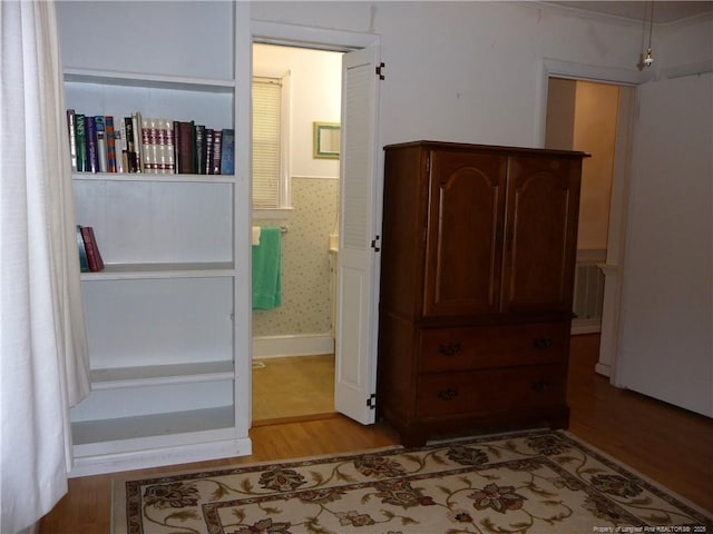 185 Meadow Rd, Lumberton, NC 28358 - bedroom with light wood-style floors and connected bathroom