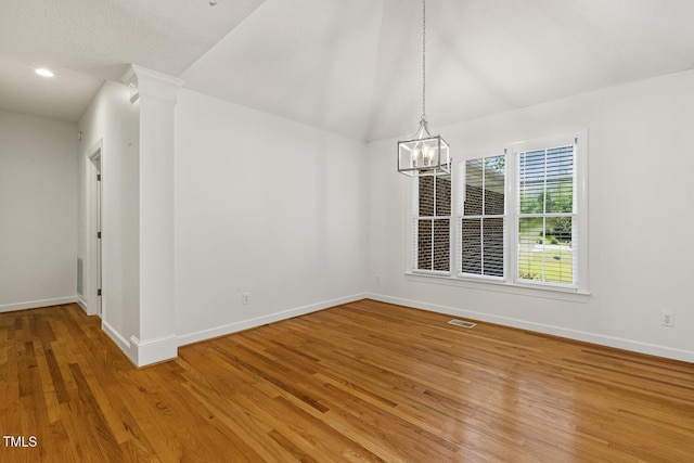 unfurnished dining area with a notable chandelier, baseboards, and visible vents