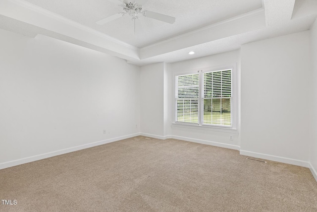 unfurnished room with baseboards, visible vents, ornamental molding, and light carpet