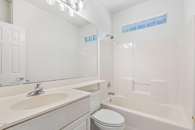 bathroom with shower / bathtub combination, vanity, and toilet