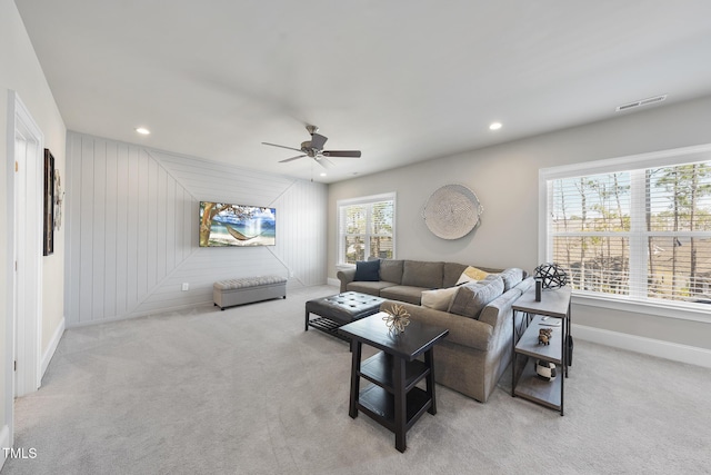 carpeted living area with recessed lighting, baseboards, visible vents, and ceiling fan