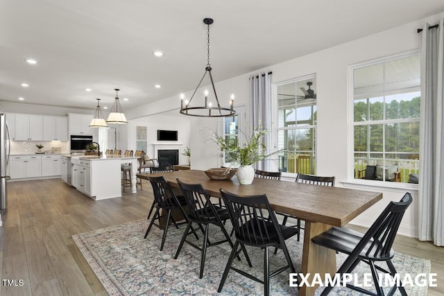 15 Celtic Ln, Lillington, NC 27546 - dining space with recessed lighting, a fireplace, and light wood-type flooring