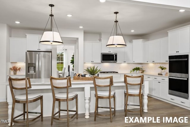 15 Celtic Ln, Lillington, NC 27546 - kitchen with light countertops, stainless steel appliances, and wood finished floors