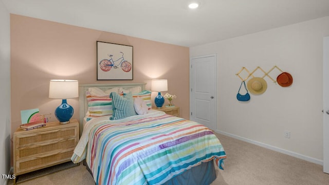 bedroom featuring carpet floors and baseboards