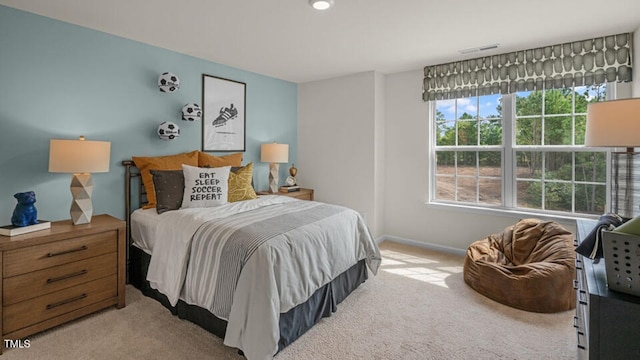 bedroom with baseboards, carpet flooring, and visible vents
