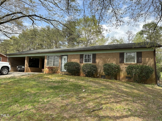 ranch-style home featuring a front lawn, brick siding, and crawl space