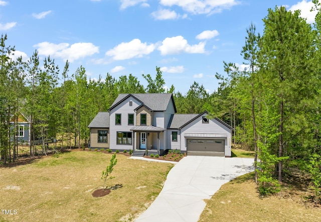 modern inspired farmhouse featuring a garage, a front lawn, concrete driveway, roof with shingles, and metal roof