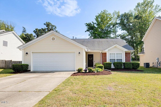 ranch-style house featuring fence, an attached garage, brick siding, a front yard, and driveway