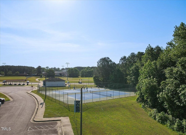 exterior space featuring a lawn and fence
