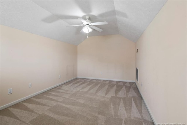 2495 Ohara Dr, Raeford, NC 28376 - carpeted empty room with baseboards, ceiling fan, and vaulted ceiling