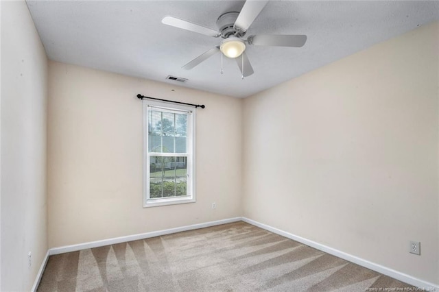 2495 Ohara Dr, Raeford, NC 28376 - carpeted spare room featuring baseboards, a ceiling fan, and visible vents