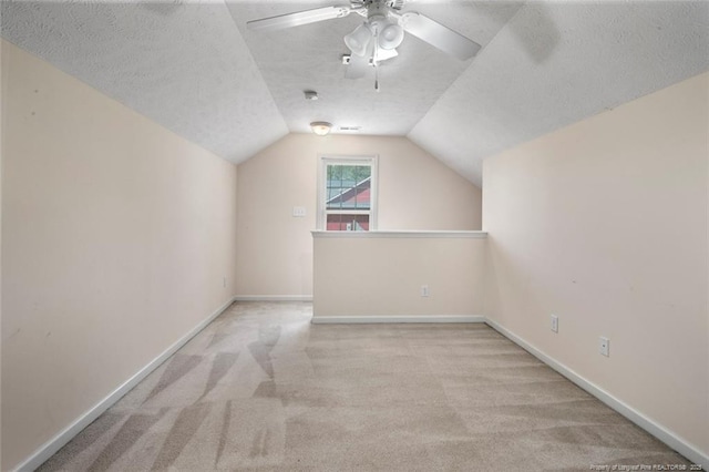 2495 Ohara Dr, Raeford, NC 28376 - bonus room with carpet floors, a ceiling fan, a textured ceiling, and vaulted ceiling