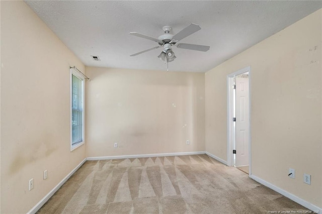 2495 Ohara Dr, Raeford, NC 28376 - unfurnished room with carpet flooring, a ceiling fan, baseboards, and visible vents