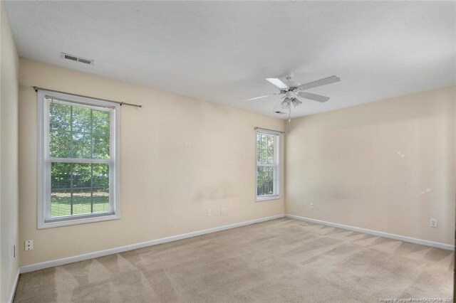 2495 Ohara Dr, Raeford, NC 28376 - carpeted spare room with baseboards, a ceiling fan, and visible vents