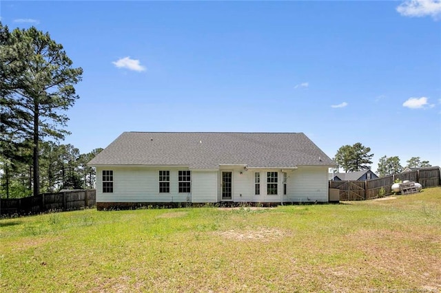 2495 Ohara Dr, Raeford, NC 28376 - rear view of house with a lawn and a fenced backyard