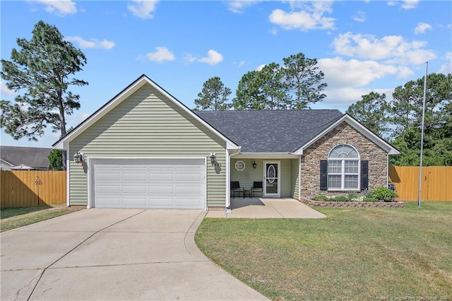 single story home featuring a front lawn, fence, stone siding, an attached garage, and driveway