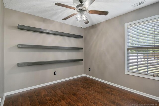 unfurnished room with wood-type flooring, baseboards, and ceiling fan