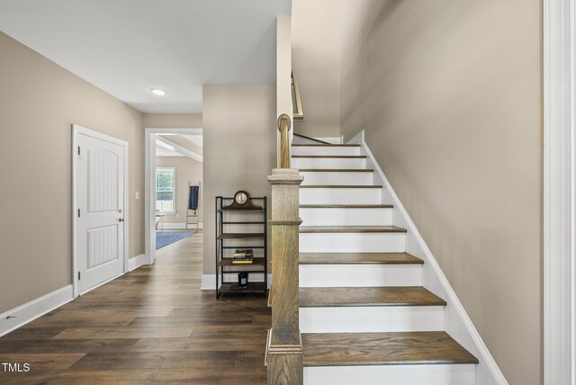 staircase featuring recessed lighting, baseboards, and wood finished floors