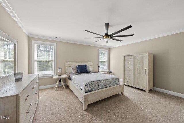 bedroom featuring a ceiling fan, visible vents, crown molding, light colored carpet, and baseboards