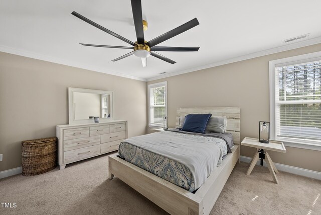 bedroom featuring carpet floors, baseboards, visible vents, and ornamental molding