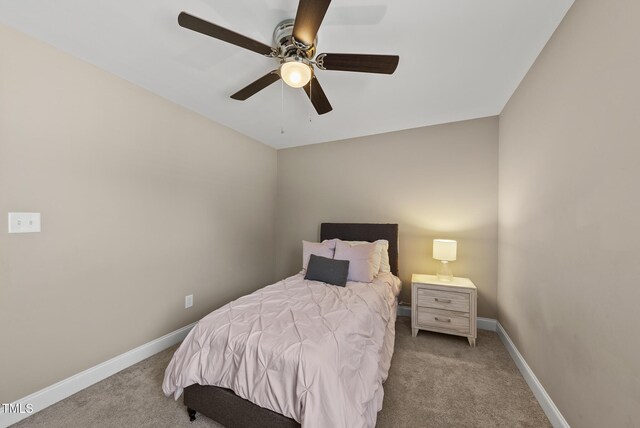 bedroom with carpet floors, a ceiling fan, and baseboards