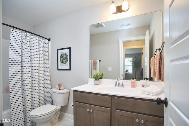 bathroom with visible vents, a shower with curtain, toilet, and vanity