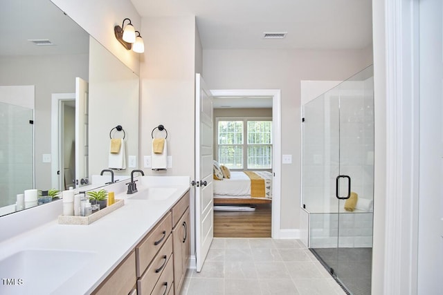 bathroom featuring visible vents, a sink, connected bathroom, and a stall shower