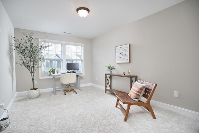 office area with carpet flooring, baseboards, and visible vents